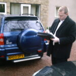 Shergroup Enforcement - Enforcement Agent Checking Vehicle Registration